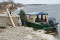 loading construction materials into taxi boat at moosonee